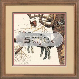 borduurpakket poes languit op boomtak