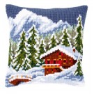 kruissteekkussen chalet in winters gebergte